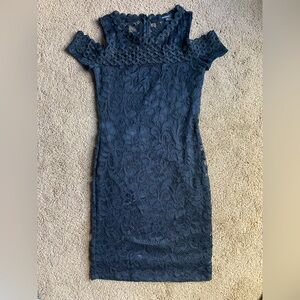 Black fitted dress with black lace. Open shoulder